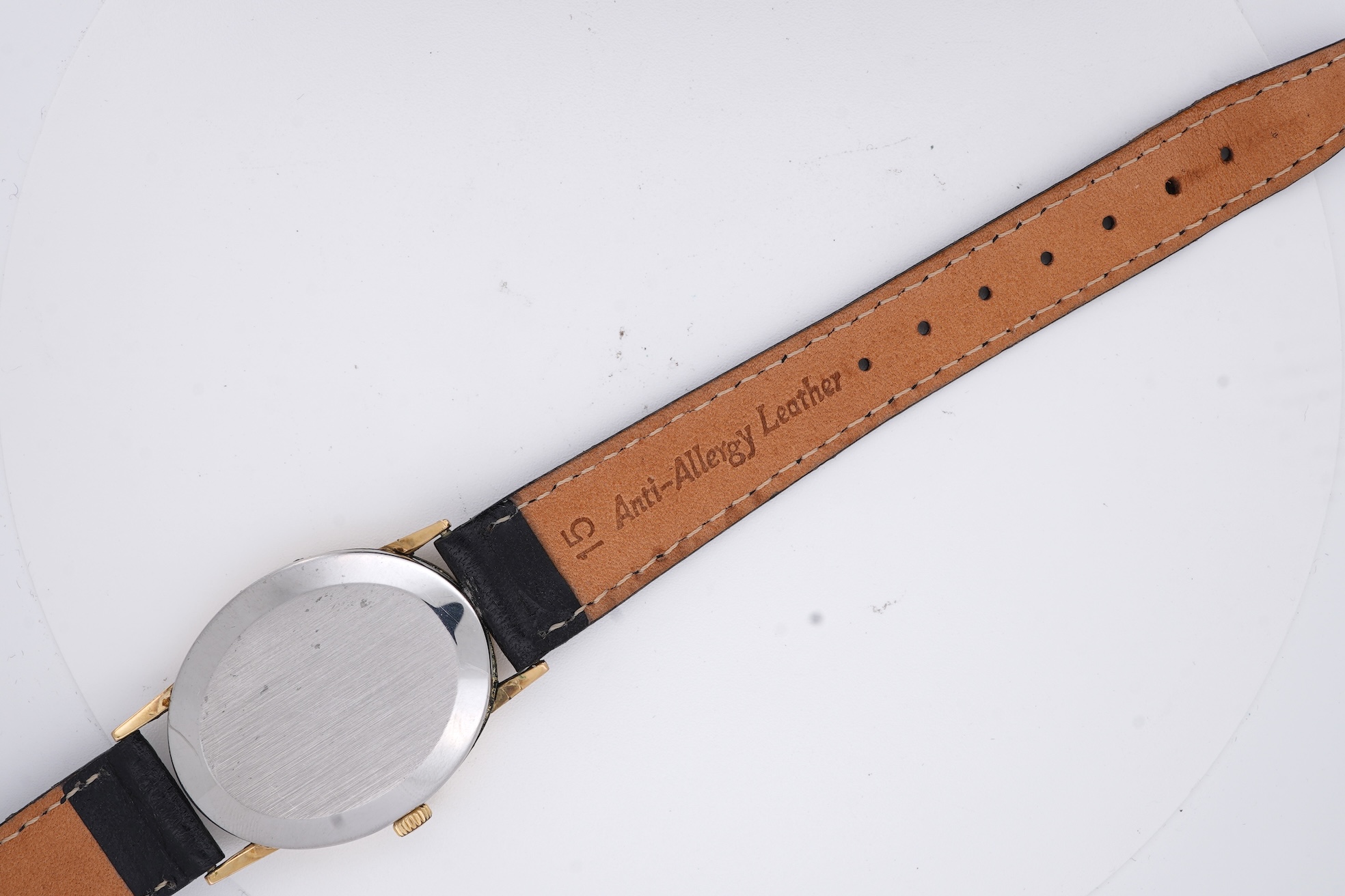 A lady's early 1970's steel and gold plated Omega manual wind wrist watch, with oval dial and baton numerals, case diameter 26mm, movement c.620, on an associated leather strap, with box no papers.